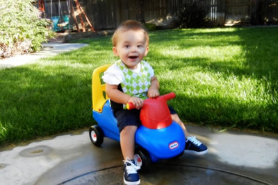 Child playing in a LENA vest