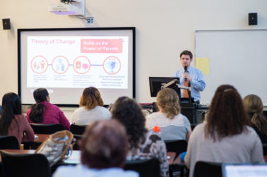 A professor presents to a class.