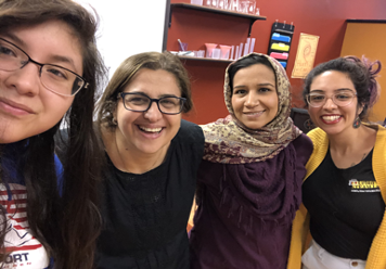 Dr. Reem and her team smile for a photo.