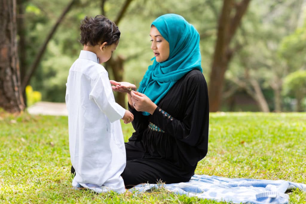 Arabic mother playing with little boy