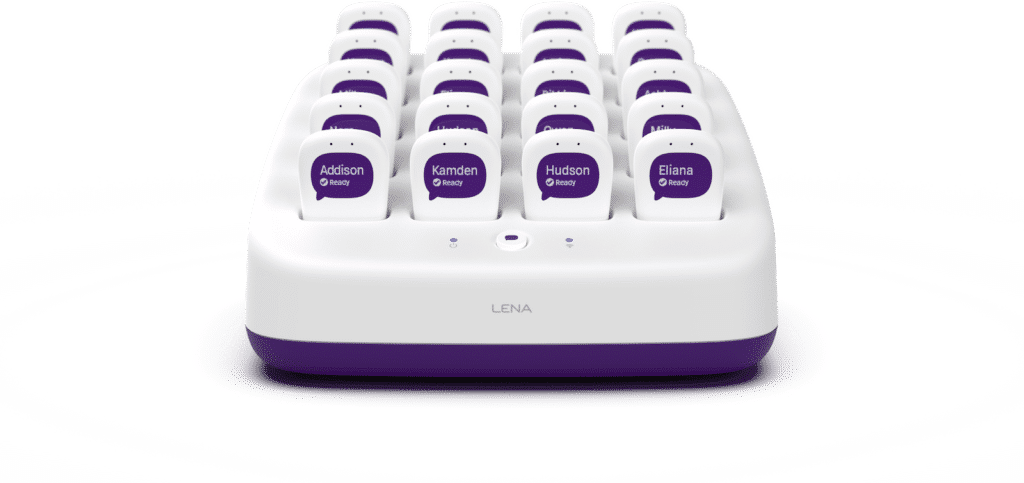 A white and purple charging station holds multiple labeled devices with names such as Addison, Kamden, Hudson, and Eliana. The front of the charging dock is labeled "LENA.