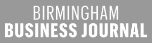 Logo with white text on a gray background that reads "Birmingham Business Journal," with "Birmingham" above "Business Journal" in bold capital letters.