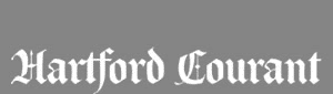 The logo for the Hartford Courant newspaper, featuring the name in a white, stylized gothic font on a gray background.