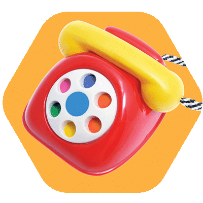 A colorful toy rotary phone with a red body, white and multicolored dial, yellow handset, and black-and-white cord, set against an orange hexagonal background.
