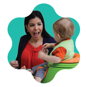 A woman sits with two toddlers, one in white and green and the other in pink, playing with colorful cups against an orange, rounded background shape.