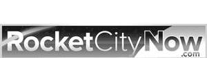 Logo for RocketCityNow.com, with "RocketCityNow" in bold white text on a dark background and ".com" in lighter text underneath.