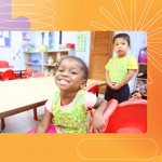 Three young children in a classroom sit and stand by a table, smiling and wearing green aprons. The background is orange with abstract shapes and puzzle piece designs.