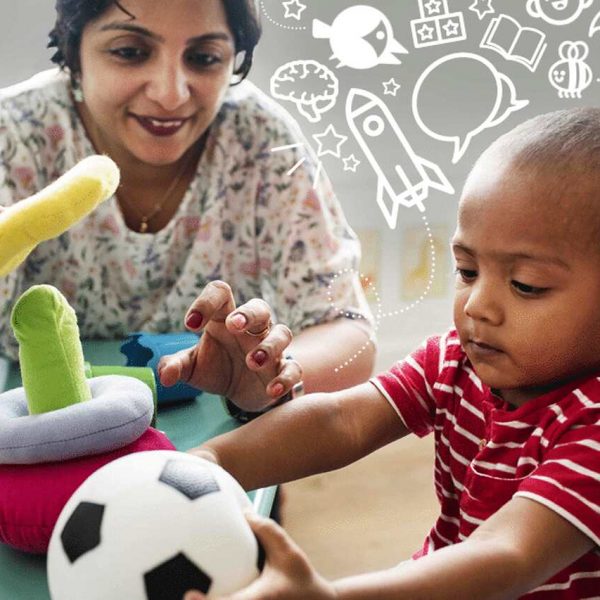 A woman and a toddler play with soft toys at a table. The child holds a soccer ball, while the woman helps with a stacking toy. White doodles of books, rockets, and speech bubbles decorate the background.